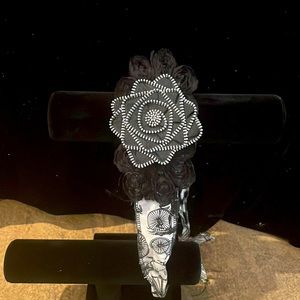 Vintage bike headband with zipper rose accent.